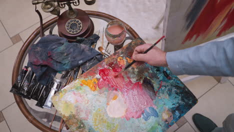 artist painting in their studio