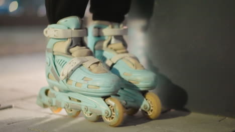 close-up of rollerblades gently rolling in place against a nighttime background with soft, diffused lighting. the motion and detail of the skates, evoking a sense of nighttime activity,urban lifestyle