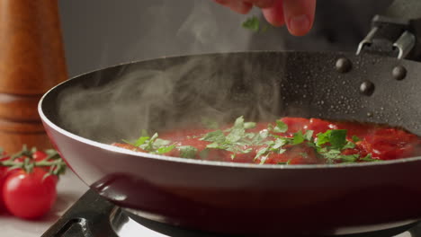 preparing a red sauce dish