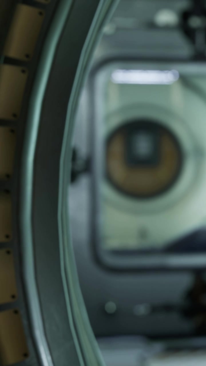 Close up of a washing machine with an open door in a laundry room