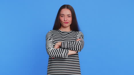 funny bully caucasian young woman showing tongue making silly faces fooling around joking teasing