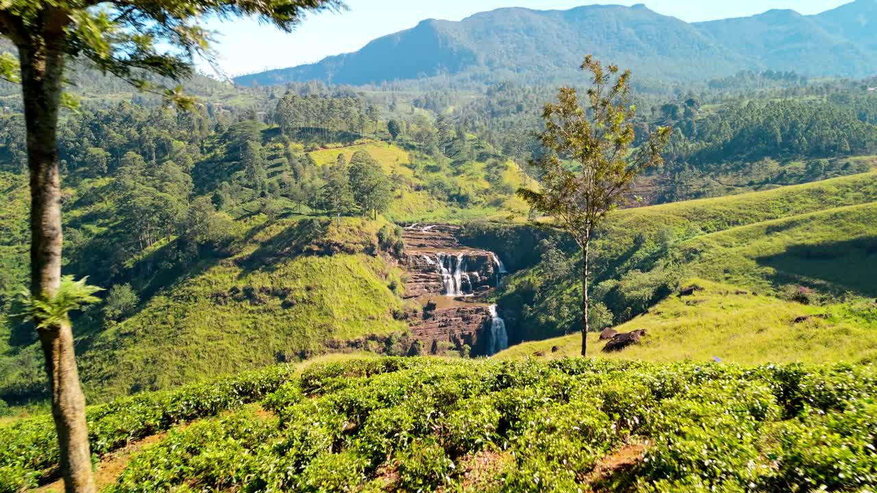 Soar over the lush green tea plantations of Nuwara Eliya and witness the stunning Saint Clairs Waterfalls cascading through the landscape.