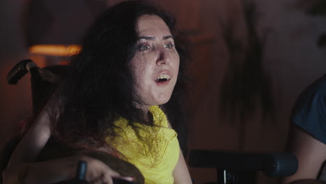 woman in wheelchair reacts with surprise