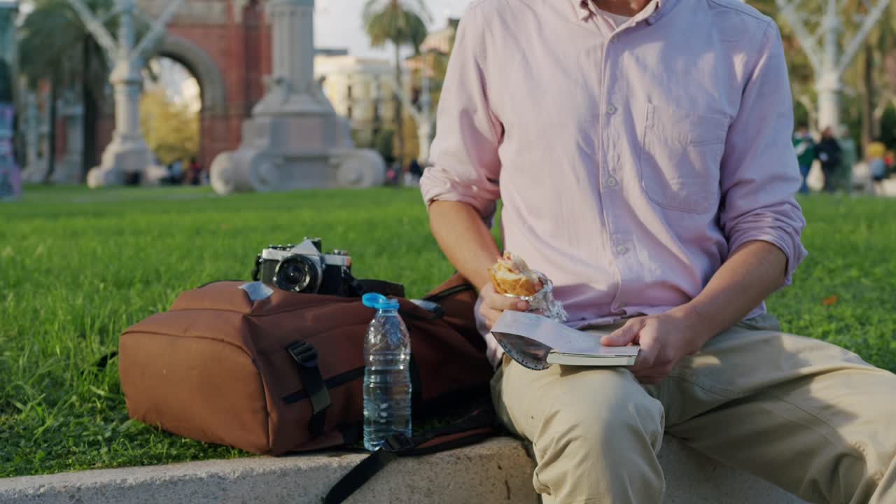 Man eating a snack in the park