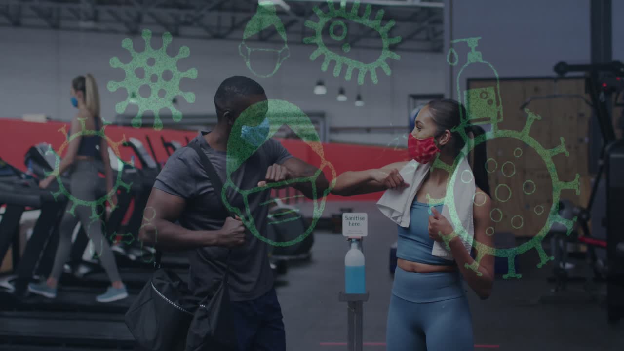 Animation of covid-19 icons floating over diverse group wearing face masks working out