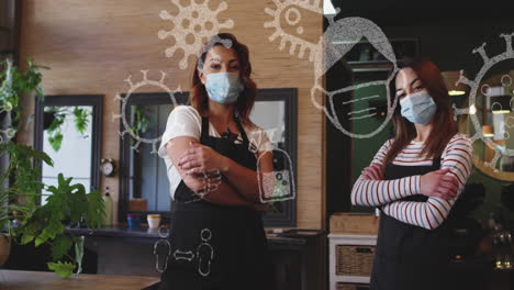 animation of coronavirus icons over two caucasian female hairdressers wearing face masks