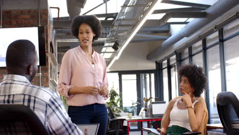 a diverse group of colleagues discuss and brainstorm ideas in a modern office