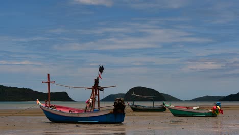 Fishing-Boats-mooring-in-low-tide-are-usually-seen-as-part-of-a-romantic-provincial-seascape-of-Khao-Sam-Roi-Yot-National-Park,-Prachuap-Khiri-Khan,-in-Thailand