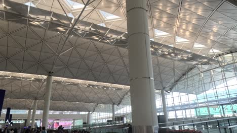 travelers navigate through bustling airport terminal