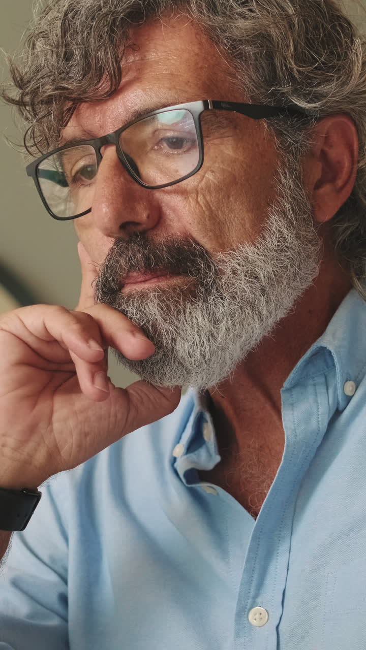 Portrait of a Man with Gray Hair and Glasses