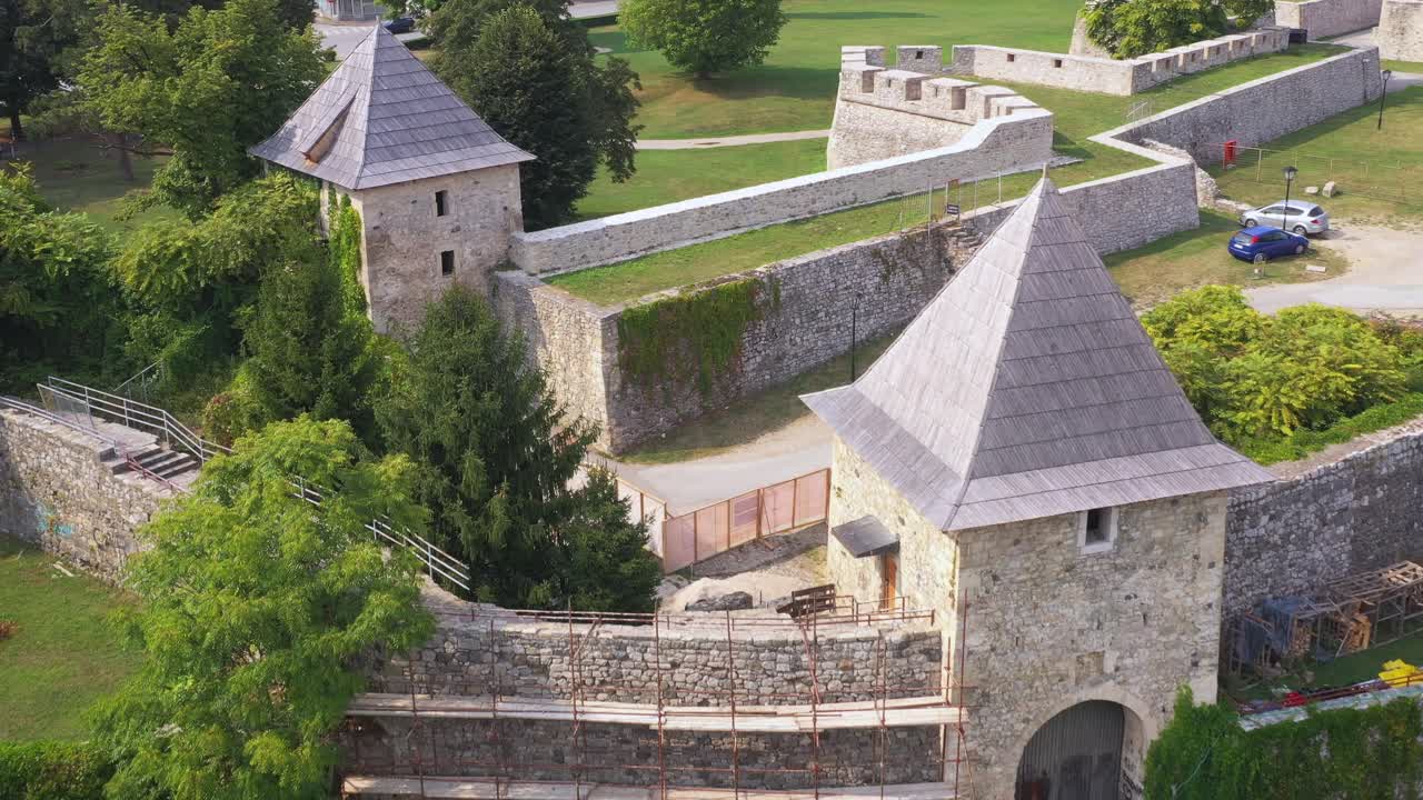 Strong white stone towers and thick walls of castle, Bosnia, Herzegovina, aerial