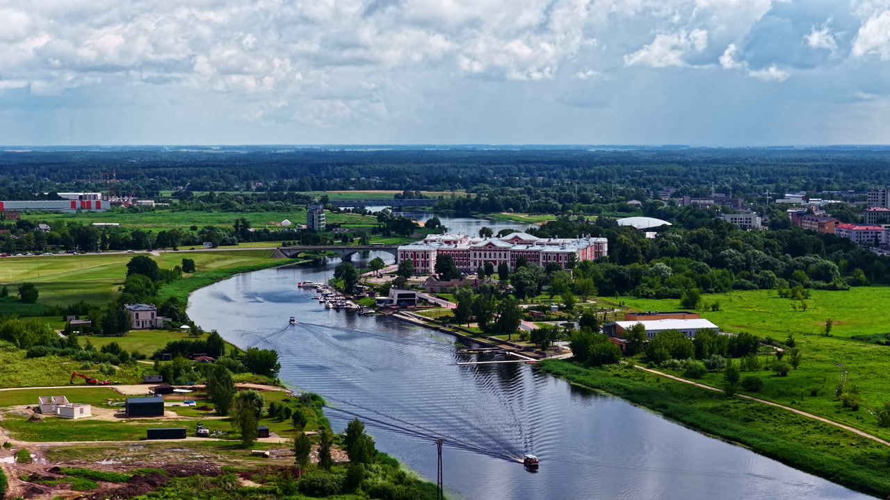 Aerial time lapse of boats sailing through Jelgava river in Latvia