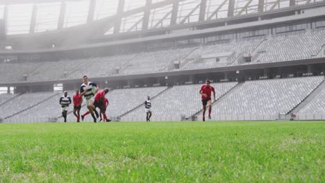 Rugby-players-playing-rugby-match-in-stadium-4k