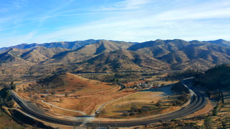 wide angle sliding aerial view of the famous tehachapi loop on a beautiful day