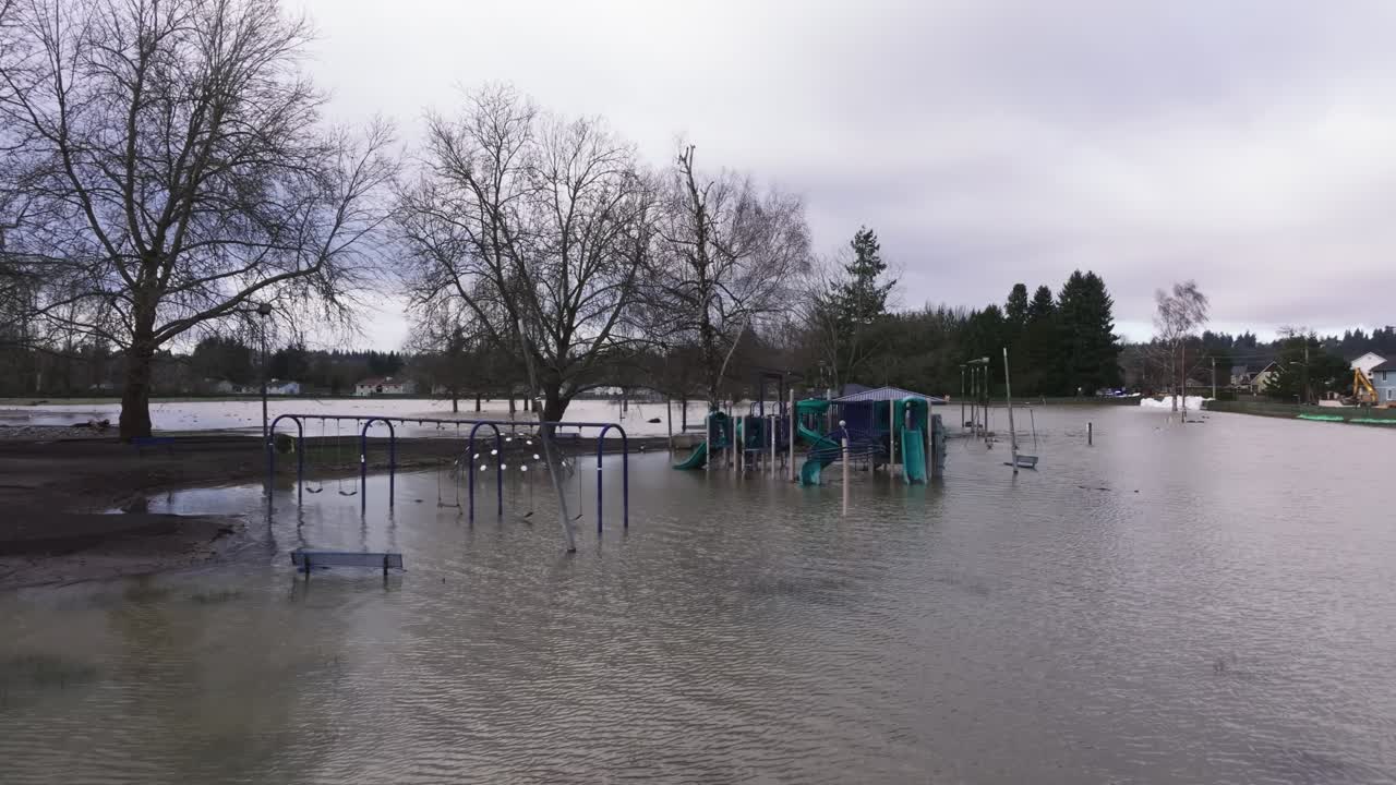 Flooded Playground At The City Park Of Pacific After The Levee Breaks In Washington State, United States. Aerial Shot
