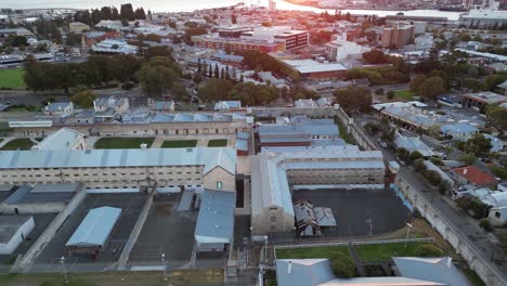 drone flying over australia prison in fremantle perth city seascape sunset