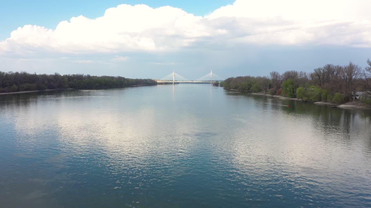 Drone footage from Danube river in spring nice weather, Budapest drone moves fast forward on low altitude