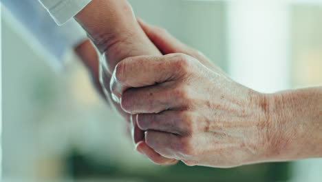 caregiver, senior woman and holding hands