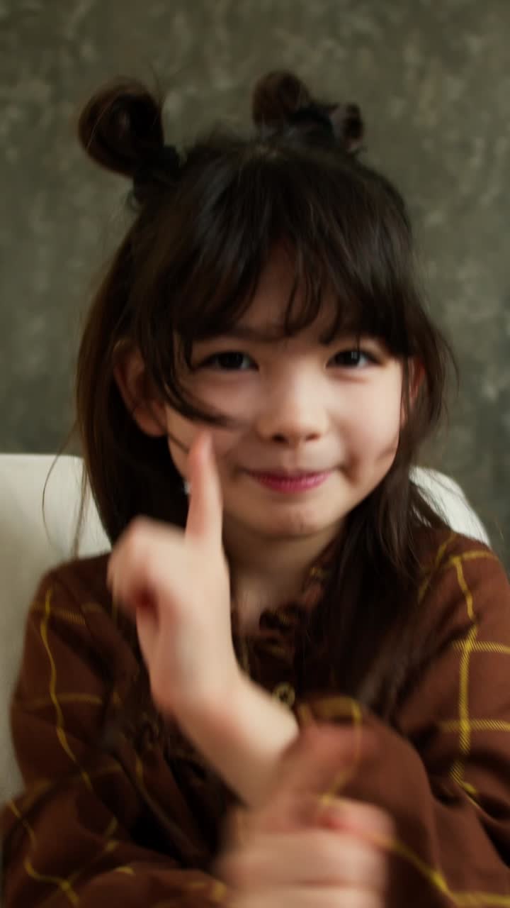 Smiling Girl in a Plaid Shirt