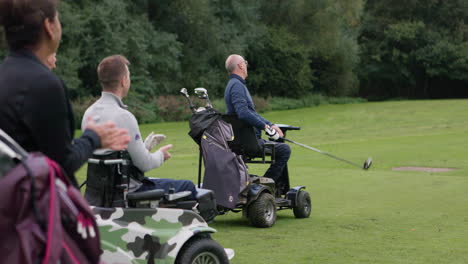 golfers playing golf using mobility aids