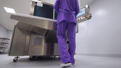pharma manufacturing machinery. worker approach to pharmaceutical equipment