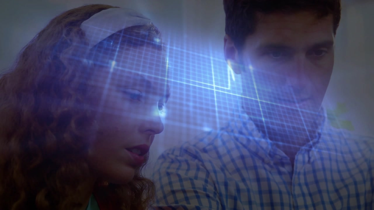Coworkers leaning as holographic display projecting blue grid, analyzing metrics for business plan