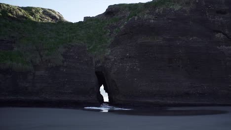 coastal landscape with rock formation and beach