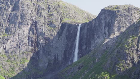 scenic view of the mountains and mardalsfossen falls in norway on a sunny day - wide shot