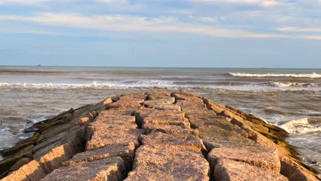 Waves-breaking-in-front-of-the-granite-jetty