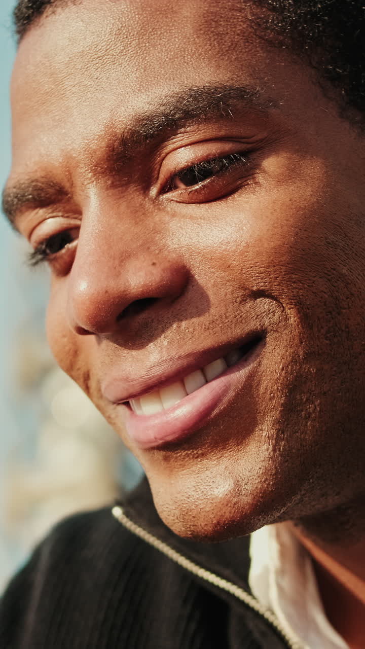 Close-up of a Young African American Man Smiling Outdoors