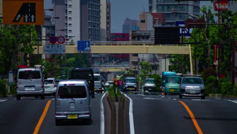 a timelapse of the traffic jam at the urban street in tokyo long shot