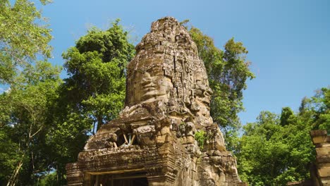 stone carving of smile face tower at banteay kdei temple, part of the angkor wat complex in siem reap, cambodia