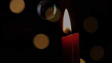 animation of lit candle with flickering spots of light