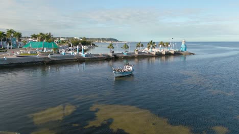 pelicans sit huddled together in a boat in a mexican city campeche