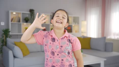 Happy-girl-child-waving-at-camera.