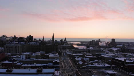 Overhead-drone-footage-of-ByWard-Market-Parliament-Hill-Ottawa-Ontario-Canada-Glebe-in-winter-with-sunset