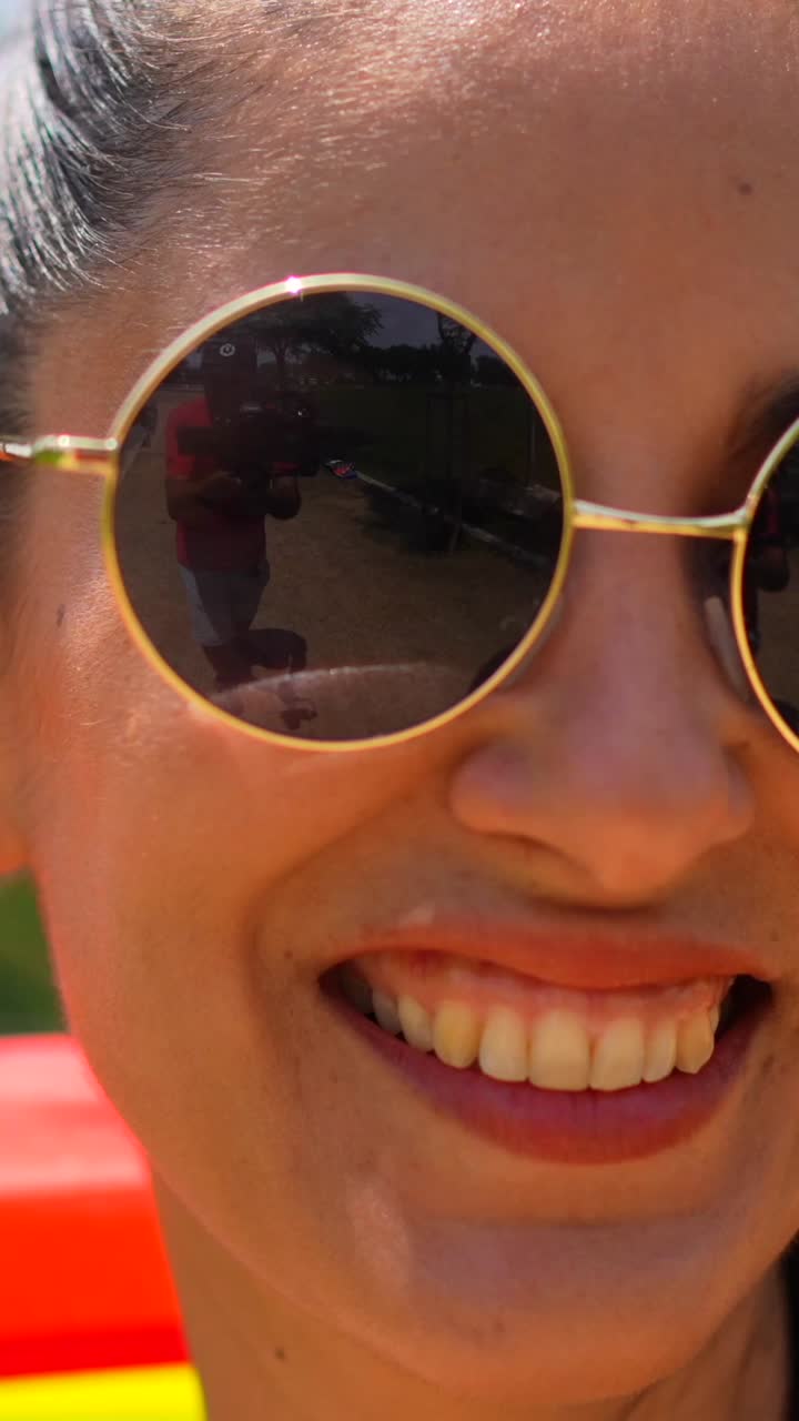 Woman with Rainbow Flag in Park