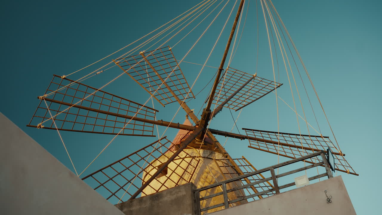 Historic windmill at Marsala salt flats Stagnone Nature Reserve Sicily
