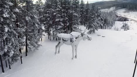 "the big elk" is the second largest moose satute in the world. 4k drone ascend with tilt as an end shot showing the landscape. the statue was created by linda bakke.