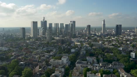 Green-City-of-Frankfurt-with-modern-suburbs-and-the-Skyline-in-the-back-on-a-sunny-spring-day-with-a-drone