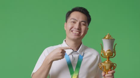 man holding a trophy