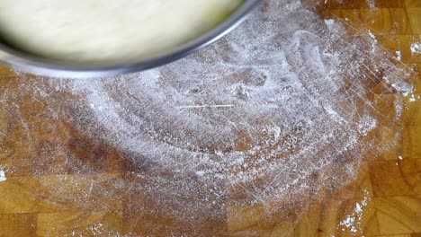 Turning-Out-The-Dough-From-The-Bowl-After-Raising