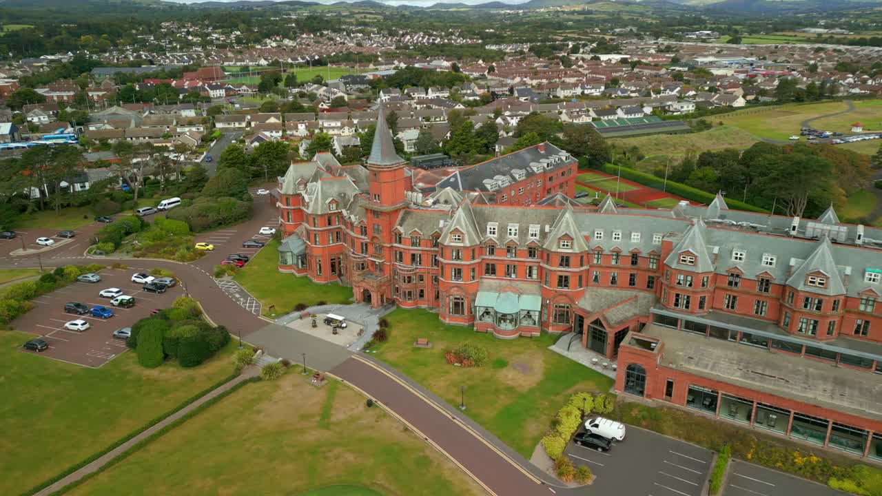 4K, 60FPS aerial video of the Slieve Donard Hotel in Newcastle, County Down in Northern Ireland. The camera travels left to right