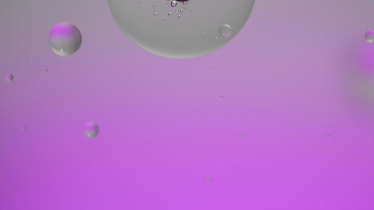 Colorful artistic of oil drop floating on the water.