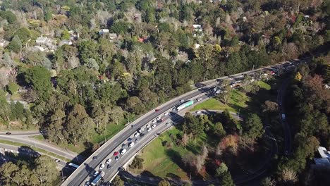 Drone shot over traffic banked up on the South Eastern Freeway, Mount Lofty Ranges - South Australia