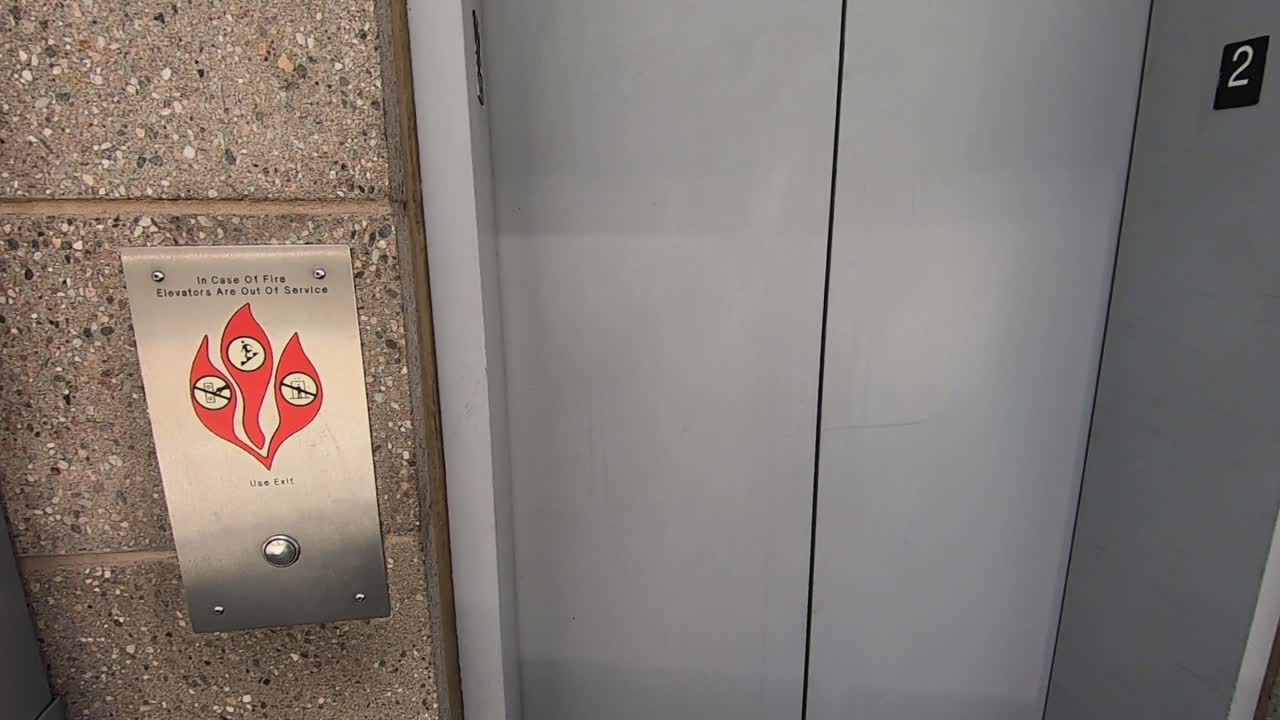 Point of view, time-lapse of doors opening entering an elevator pressing the button and doors closing.