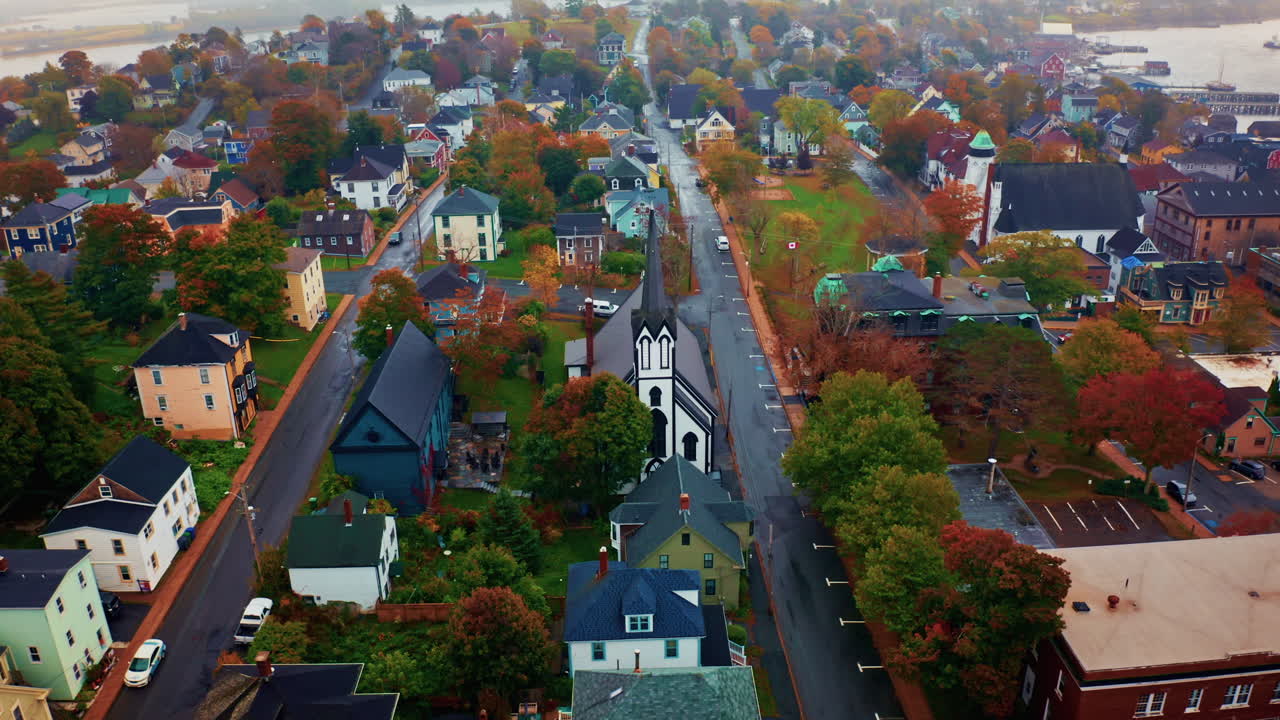 Aerial drone shot over the local town of Lunenburg in Nova Scotia, Canada. Fishing lobster town. Foggy misty day.