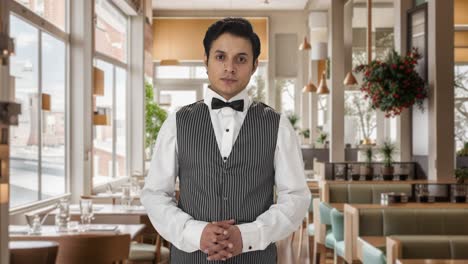 Happy-Indian-waiter-looking-to-the-camera