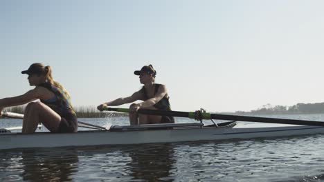 female rowers training on a river