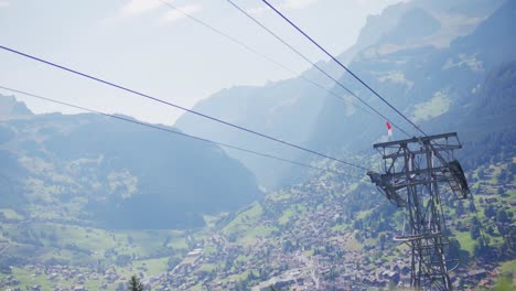 Ski-lift,-moutains,-village,-aerial,-valley,-Switzerland